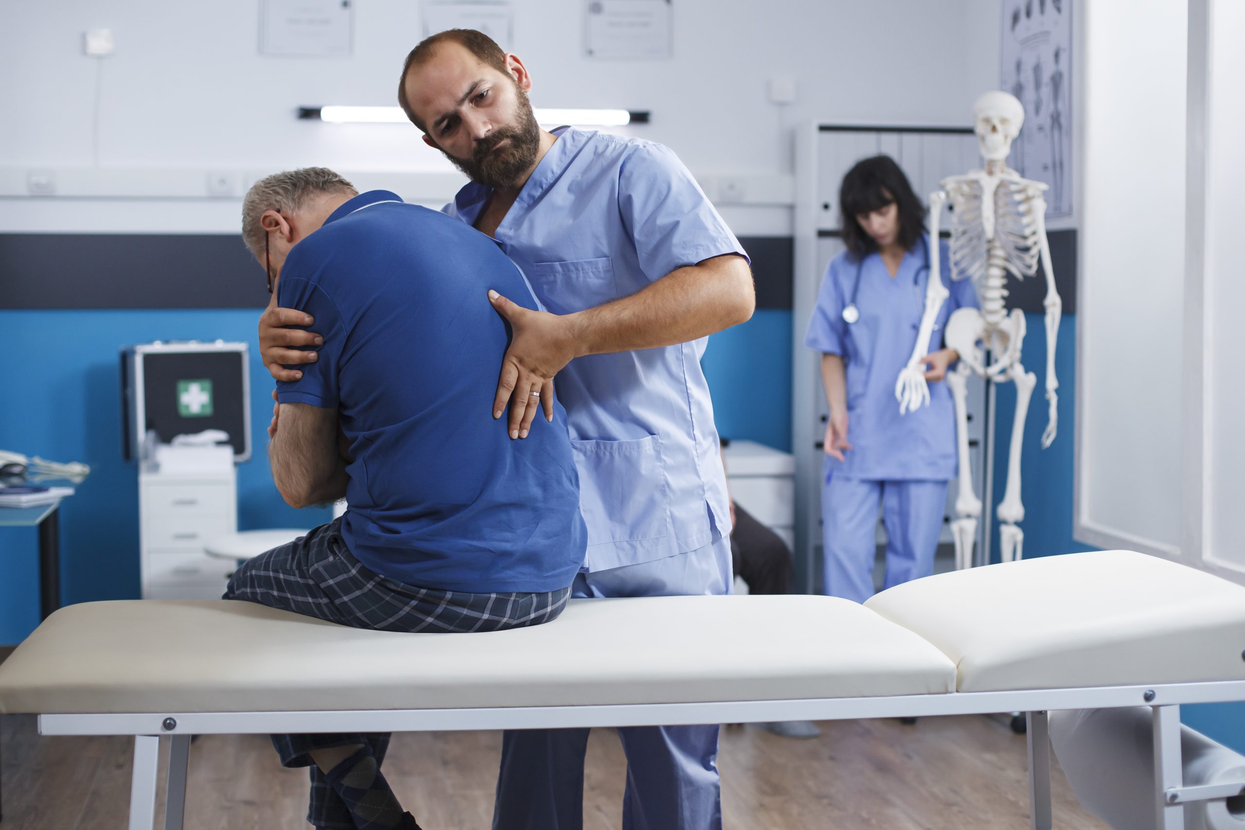Physical therapist treating a patient with back pain