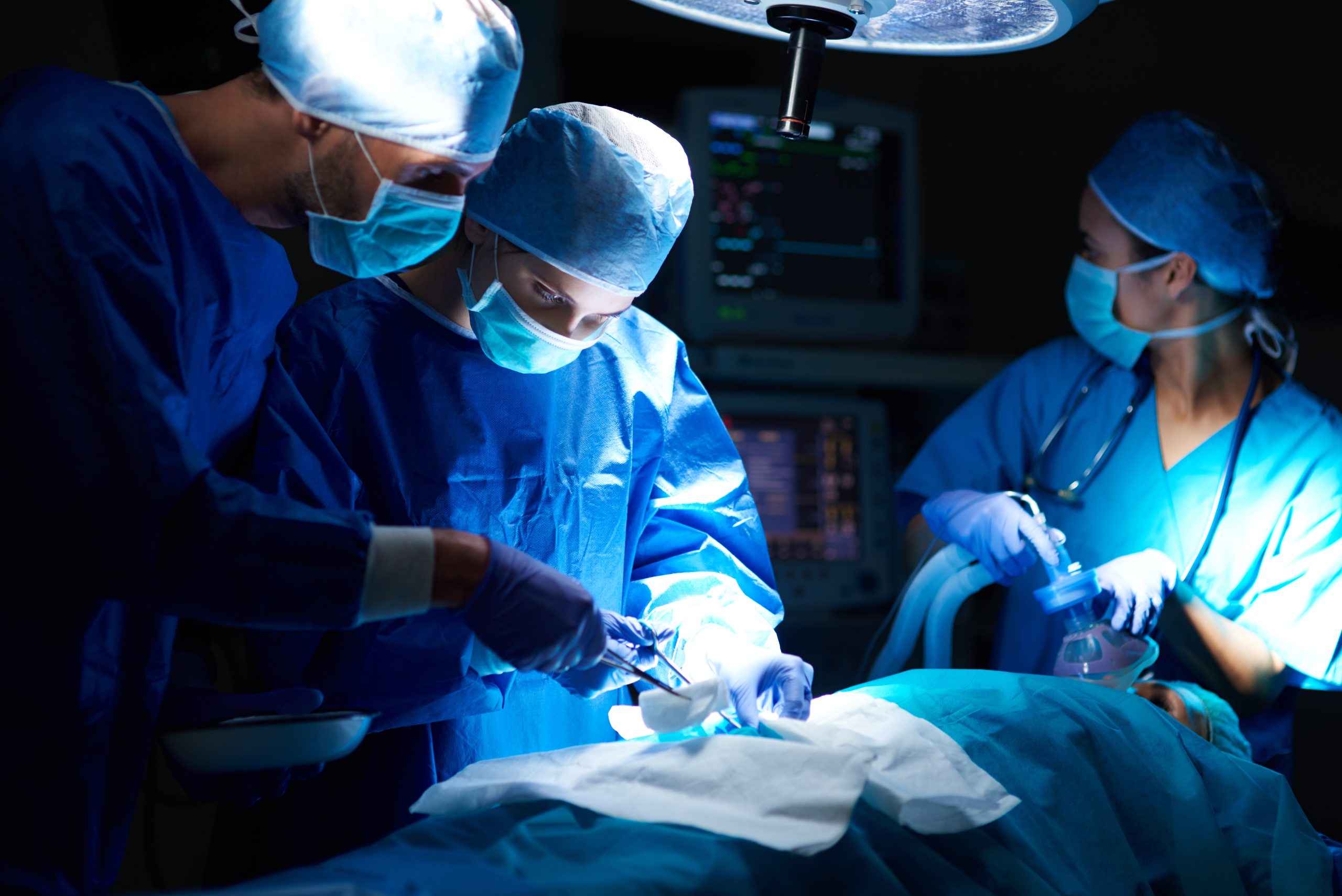 Surgical team performing minimally invasive spine surgery